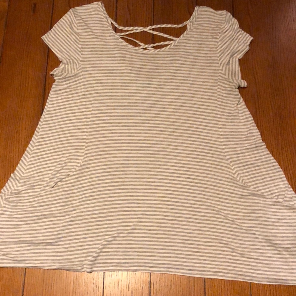 Maurice’s light grey and white striped blouse.